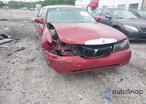 1999 Lincoln Town Car Signature z USA, uszkodzony, nr VIN 1LNFM82WXXY601583